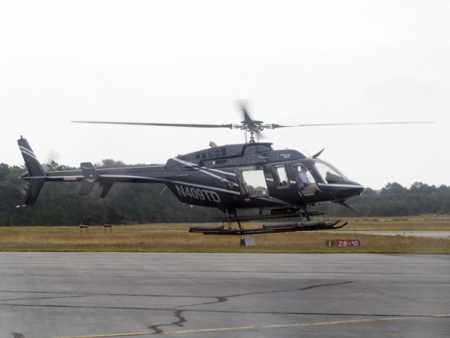Bell 407 (N409TD) - Lift off.