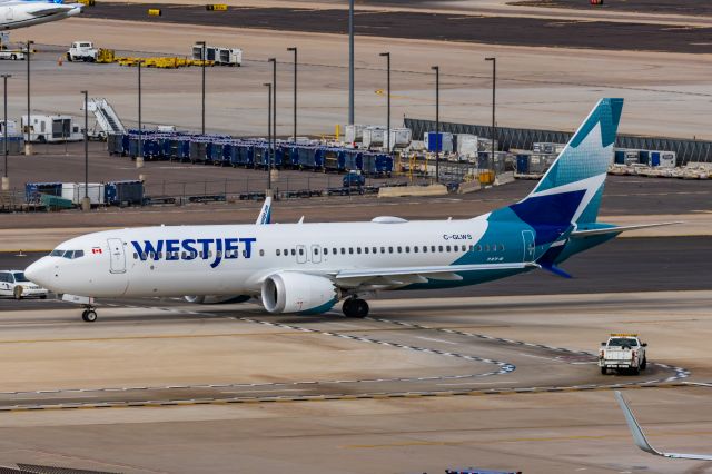 Boeing 737 MAX 8 (C-GLWS) - A WestJet 737 MAX 8 taxiing at PHX on 2/13/23, the busiest day in PHX history, during the Super Bowl rush. Taken with a Canon R7 and Canon EF 100-400 II L lens.