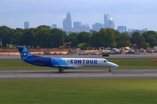 N27512 — - 27512 taking off on Rwy 18C with the Charlotte skyline in the background