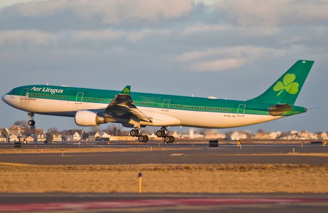 Airbus A330-300 (EI-DUZ) - Shamrock one tree seven heavy landing zero four right @ KBOS Logan Airport on FlightAware.Com - Golden Hour !