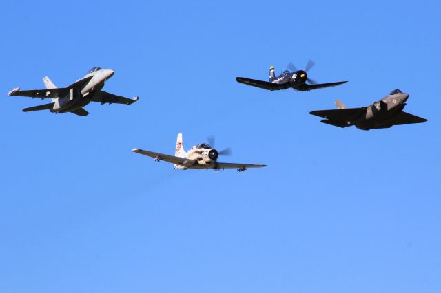 Douglas AD Skyraider (N65164) - The Douglas Skyraider leads today's Navy Heritage Flight at AirVenture '22.br /br /A generous portion of Navy/Marine and Air Force Heritage Flights during Oshkosh '22 kept aviation photo buffs busy.