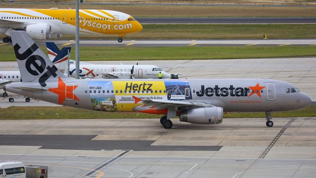 VH-JQX — - Seen here wearing a promotional livery for Hertz car rentals.