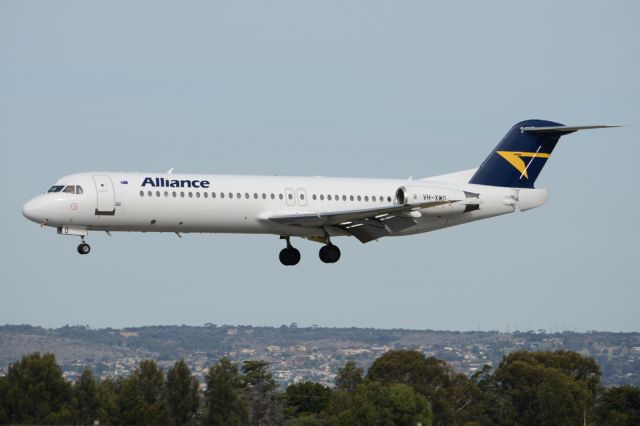 Fokker 100 (VH-XWO) - On short finals for runway 05. Thursday, 8th May 2014.