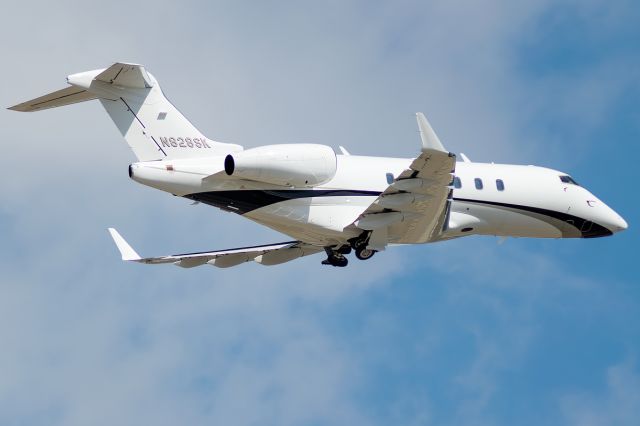 Bombardier Challenger 300 (N828SK) - Sleek as sleek can be cutting through the clouds on its way to Texas