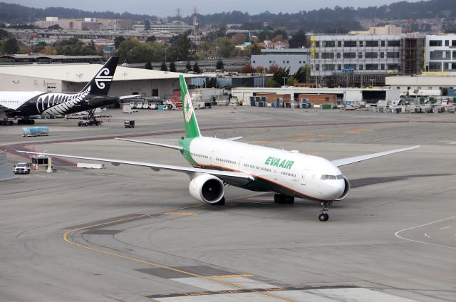 BOEING 777-300ER (B-16740) - KSFO - EVA Air 777-300ER arriving at International Terminal G on Nov 13th, 2017 from TPE. Now that the 747 is pretty much gone, this is my new favorite jet 773ER, though I have always loved the 773ER from day 1! I wonder if the poor sucker working in the small hut under the wing brings a camera to work?