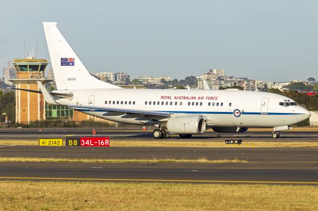 Boeing 737-700 (A36001) - Royal Australian Air Force (A36-001) Boeing 737-7DT (BBJ) taxiing at Sydney Airport. Now wearing a large Australian flag on the tail, where the fin flash once was located.