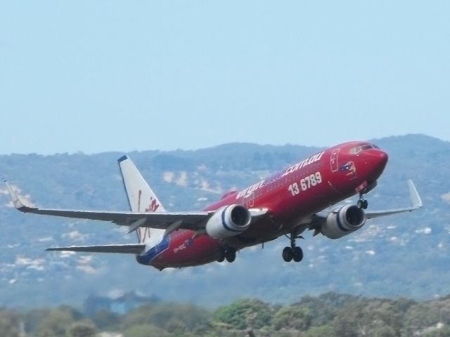 Boeing 737-700 (VH-VUC) - Getting airborne off runway 23. 18th January 2012.