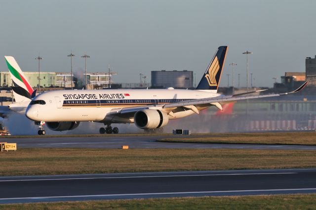 Airbus A350-900 (9V-SMP) - SIA51 with reversers deployed removing some runway water on arrival from IAH.
