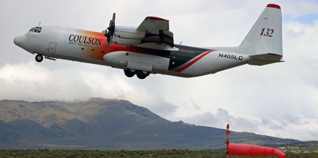 N405LC — - Coulson Groups Tanker 32 (N405LC), a Lockheed L-382G, is snapped here on May 20, 2016, as it climbs into a strong wind during takeoff from Reno Stead Airport (KRTS).  The wind and clouds were the prelude to a rapidly approaching storm, and about 30 minutes later as this aircraft was on approach to KRTS the storm, a SNOWSTORM, arrived with such intensity and visibility became so poor that N405LC had to divert to Reno Tahoe International and land there.  It isnt particularly rare for this area to experience snow just one month before the beginning of summer, but this storm was really VERY intense.br /When listing the aircraft type, I used the FAAs official designation (L-382G), but it should be noted that this model is also frequently IDed as an L-100-30. 