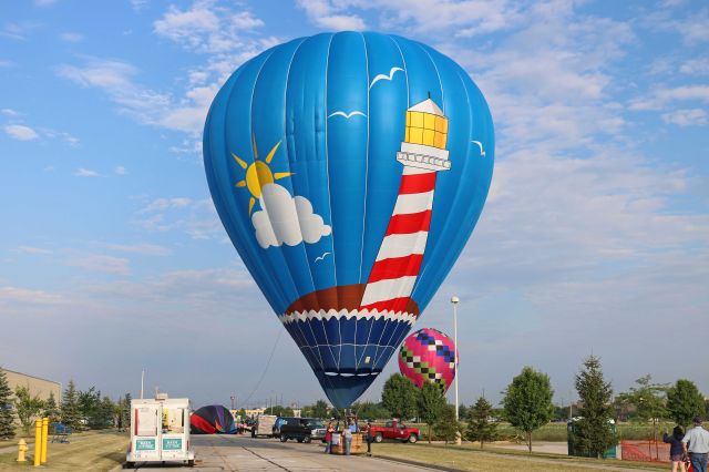 Unknown/Generic Balloon (N706FN) - Kubicek Balony SPOL SRO BB26Z, (Lighthouse) and N805ND (Maveryx) just after touchdown between Meijer and Total Sports Complex in Rossford, OH on 15 Jul 2018. Lighthouse was one of nineteen balloons that competed in the 3rd annual Glass City Balloon Race in Rossford, OH.