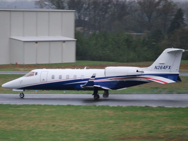 Learjet 60 (N264FX) - Rolling down runway 20 - 4/2/09