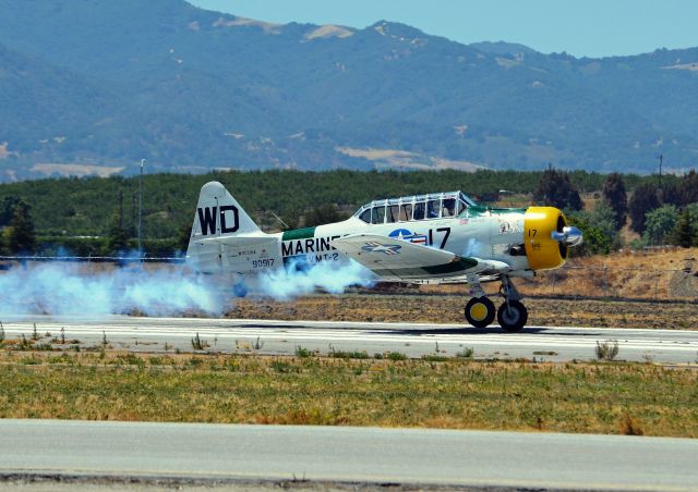 N1038A — - John Collver with his wheels just leaving the ground as he takes off to perform at the 2014 Hollister Airshow.