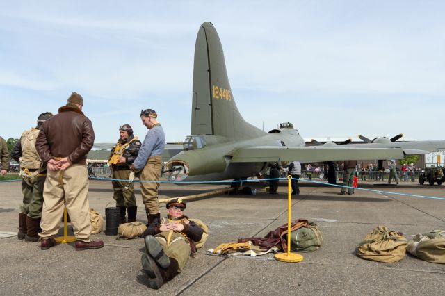 — — - Volunteers help recreate the atmosphere of a B-17 Flying Fortress Bomber Crew on stanby by at a RAF Airfield during WW II. Seen here during the Duxford Spring Airshow 2013.