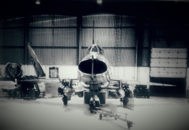 Fokker 100 — - Took this picture a long time ago at FWA back when it was Fort Wayne Air Service.  I believe that the F100 here was the only one flying at the time.  And back in the left of the hanger with the wings folded up is a Sea Fury waiting for its engine to come back from being re-built.  I believe this was taken back in 1998