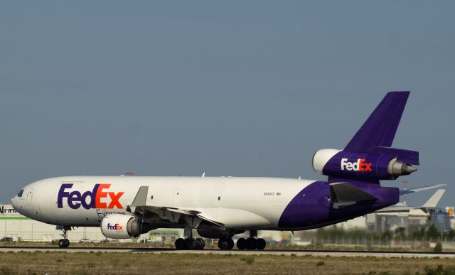 Boeing MD-11 (N584FE) - FedEx MD11 roaring down Athens runway 03L.