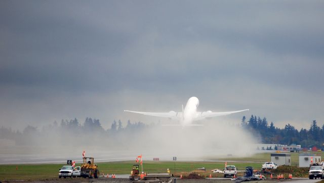 BOEING 777-300 (B-KPL) - Cathay Pacific Boeing 777 Delivery flight from Paine Field in Everett Washington to Hong Kong kicking up some water off the runway.