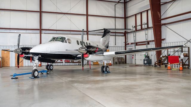 Beechcraft Super King Air 200 (N9WR) - N9WR with fresh paint sitting in its hangar at Frederick Municipal Airport 