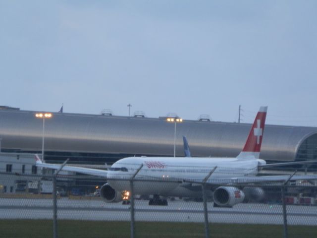 Airbus A330-300 (HB-JHC) - Departing for Zurich at dusk!