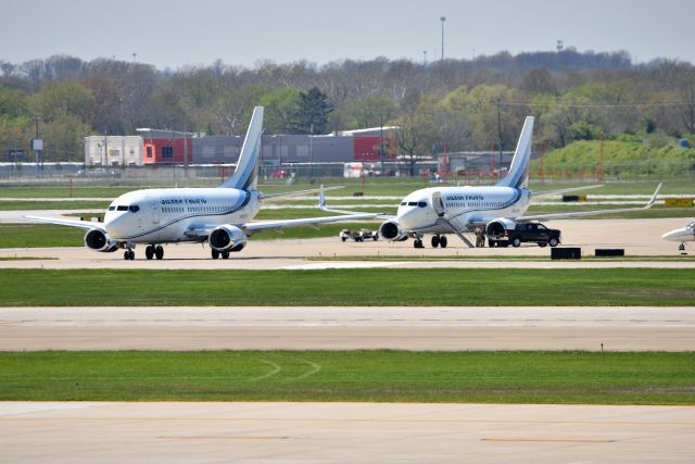 Boeing 737-500 (N708S) - Sister ships N708S in front, and N709S in the back. Shown parked on the Indy IAB ramp on 04-26-21. Apologies for the haze softness.