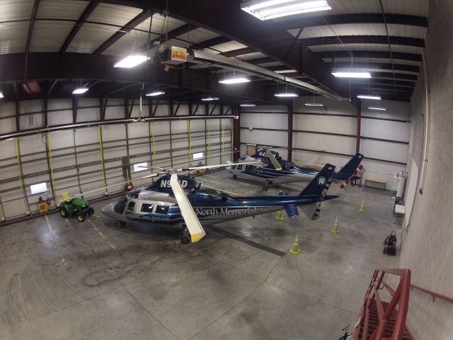 SABCA A-109 (N911D) - 911D and 40NM in the hanger at AirLake airport (KLVN). 40NM is decommissioned and awaiting a buyer. 911D is the highest hours A109C in the world!  As of 2/21/12 she goes to "11",  (11K hrs.)