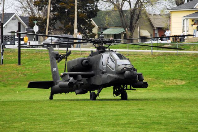 — — - A pair of AH-64s landing on the campus of the University of Central Missouri.