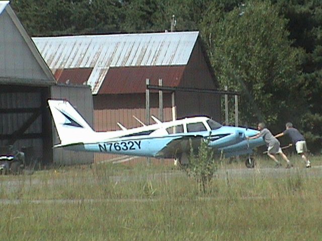 Piper PA-30 Twin Comanche (N7632Y) - Being pushed back into the hangar after a short flight.