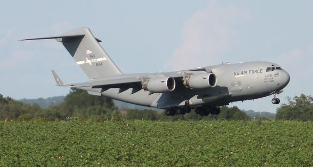 Boeing Globemaster III (AALF66156) - Boeing C-17 Globemaster III "Spirit of the Golden Bear" approaching touchdown on Runway 18R at Carl T. Jones Field, Huntsville International Airport, AL - August 10, 2017. Photo taken outside the airport perimeter fence along County Line Road.