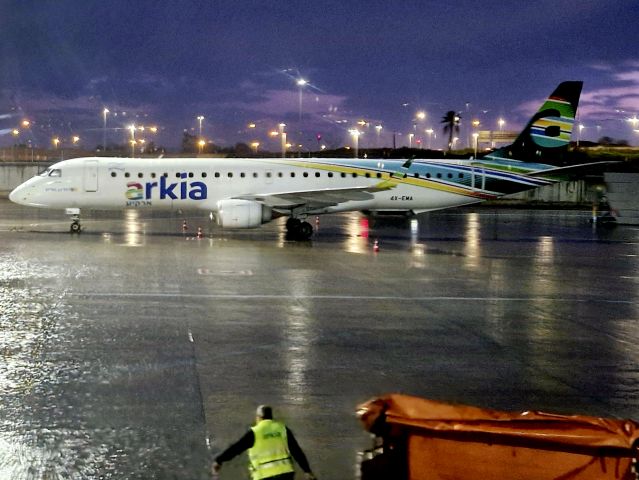 EMBRAER 195 (4X-EMA) - Rainy evening at Ben Gurion Airport.