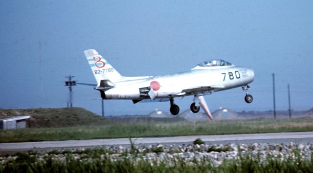 82-7780 — - A Japanese Self-Defense Force FJ-4 Fury jet landing at MCAS Iwakuni, Japan, 1967. Note deployed speed brakes.  Artifact under mid-fuselage is local windsock.