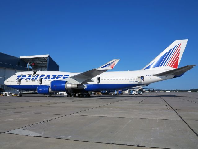 Boeing 747-400 (VQ-BHX) - Maintenance in front of the huge hangars at KRME.