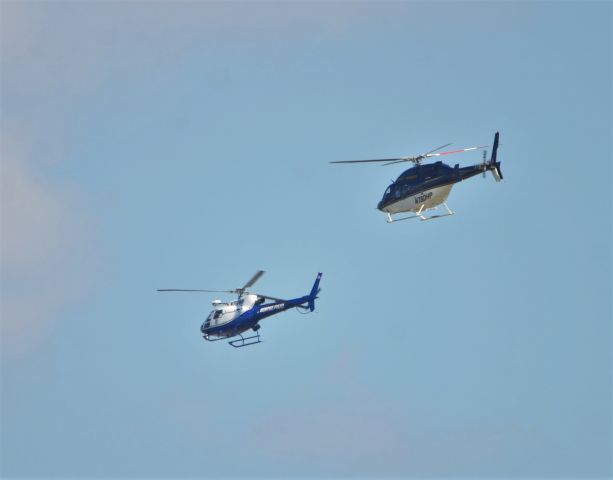 — — - Memphis Police and TN State Trooper helicopter flying together around downtown Memphis