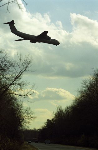 Lockheed C-141 Starlifter — - On final to McGuire Air Force Base.  October 1999.