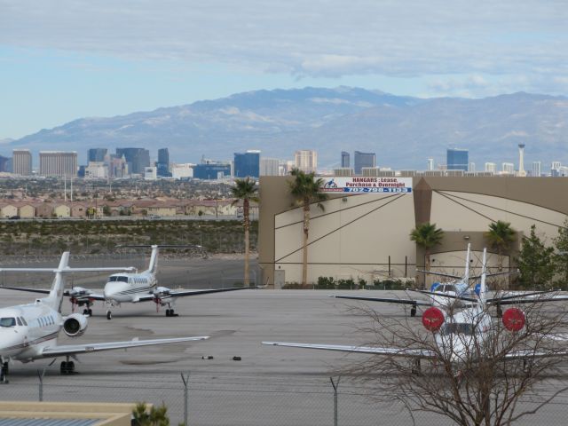 — — - The Henderson Field apron and Las Vegas cityscape