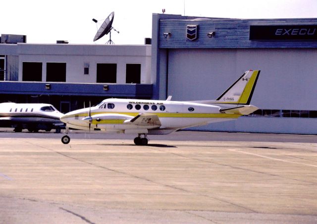 Beechcraft Super King Air 200 (C-FHGG) - CYVR - Beechcraft small commuter Wilderness Air arriving at the South Terminal at Vancouver BC Canada - photo taken long before the new South Viewing area platform existed - early 1990s photo