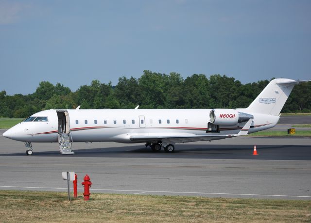 Canadair Regional Jet CRJ-200 (N60GH) - STEWART-HAAS RACING LLC parked at Concord Regional Airport / Concord, NC 7/28/11