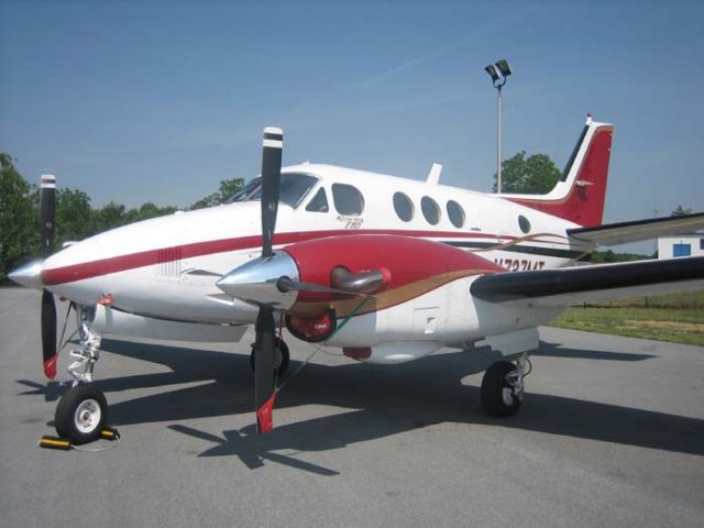 Beechcraft King Air 90 (N727MT) - King Air reigning silently with props feathered, and tethers in place. www.wvairport.org