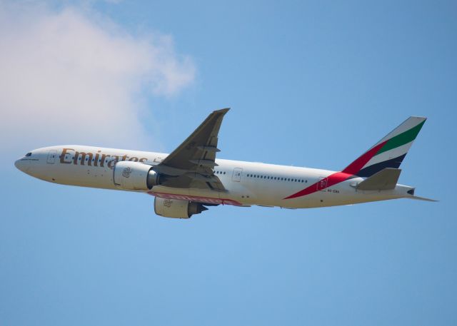 Boeing 777-200 (A6-EWA) - Departing DFW.