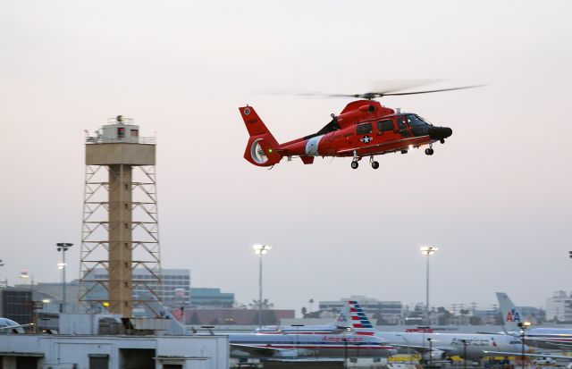 — — - This US Coast Guard HH 65C helicopter is returning to the Coast Guard Air Station Los Angeles at LAX just before sunrise Saturday, 6 Sept 2014 