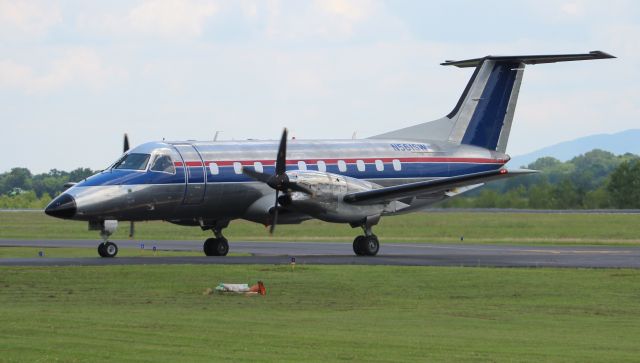 Embraer EMB-120 Brasilia (N561SW) - One of Berry Aviations Embraer EMB-120ER Brasilias taxiing onto the ramp at Boswell Field, Talladega Municipal Airport, AL - June 8, 2017.