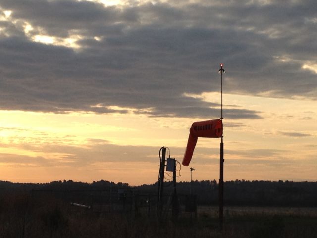 — — - Windsock at KOWD in the morning