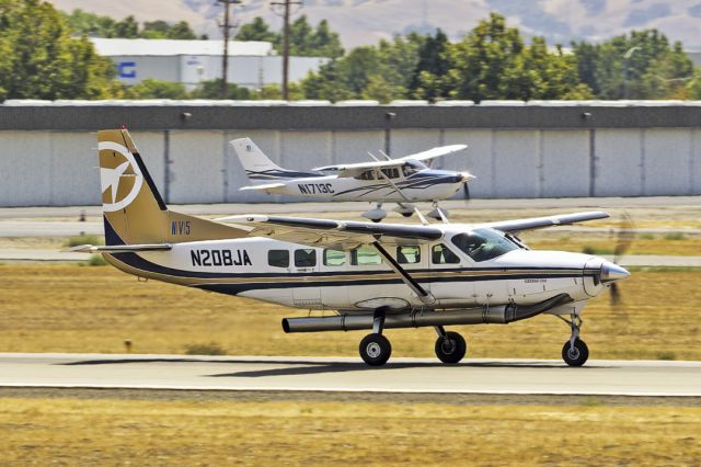 Cessna Caravan (N208JA) - N208JA Cessna 208 Caravan lands on 25R while N1713C Cessna 182T is about to touchdown on  25L at Livermore Municipal Airport, CA. August 2021.