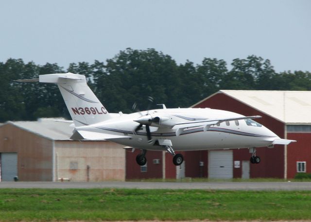 Piaggio P.180 Avanti (N369LC) - About to touch down on runway 14.