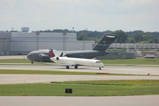 Boeing Globemaster III (N66165) - USAF C-17 Globemaster III departing light at Indy. feat Delta CRJ-900