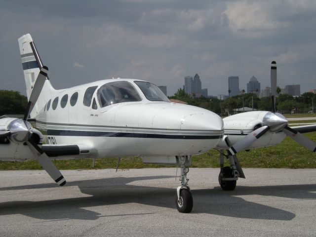 Cessna 421 (N47RL) - At the north end of Peter O Knight airport (KTPF) with downtown Tampa in the background.