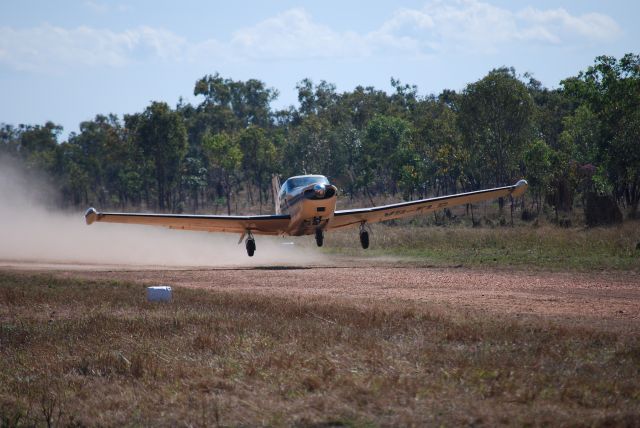 Piper PA-24 Comanche (VH-FLG) - Taking off from Mt Bundy Airstrip, 12th July 2010.