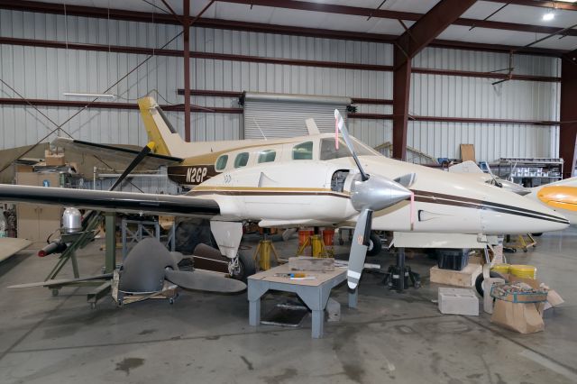 N2GP — - Inside the hangar at Planes of Fame Air Museum.  The sleek Duke was introduced by Beech in 1968, aimed at the owner-flown segment of the business aircraft market.  It was powered by a pair of 380hp Lycoming TIO-541 six cylinder turbocharged engines driving Hartzell three-blade propellers.  This Duke Model 60 was built in 1969 and is one of about 125 built.  Owners found the engines expensive to overhaul and maintaining the aircraft was likened to a high-end sports car.  Later models included the A60 and B60 with modified turbochargers and cabin pressurization.