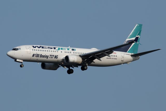 Boeing 737-800 (C-GAWS) - "WestJet 1622" with # 100 737NG titles on final to 4R, arriving from Calgary, Canada