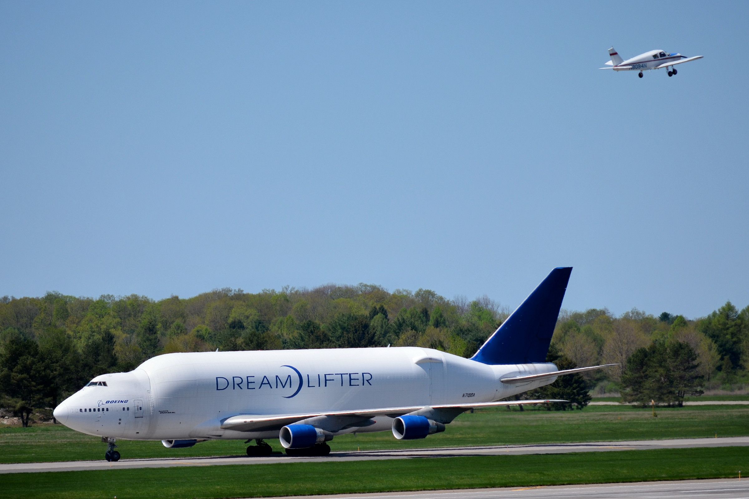 Boeing 747-400 (N718BA) - Landing for Service at Griffiss International Airport, Sunday May 11, 2014, just before noon.  On it's way to the service facility while a small private craft takes off...