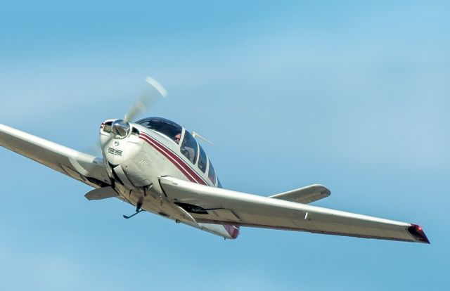 — — - Beech V-Tail taking off from runway 16. Never caught the tail number.