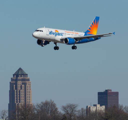 Airbus A319 (N30NV) - Allegiant 1413 is on short final into Des Moines international Airport passing by downtown Des Moines. Photo taken February 18, 2022 at 11:12 AM with Nikon D3200 at 300mm.